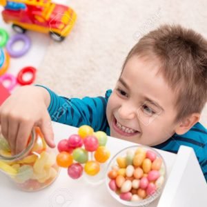 Little boy has discovered candy put aside