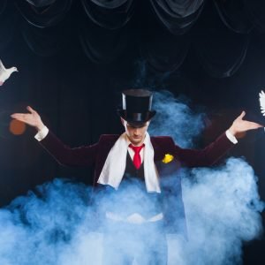 The,Magician,With,A,Two,Flying,White,Doves.,On,A