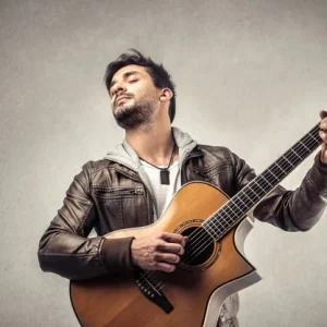 depositphotos_34894421-stock-photo-musician-playing-the-guitar