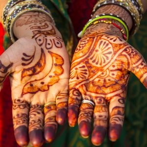 AGRA, INDIA - DECEMBER 01: Woman bride with henna tattoo near the famous indian sightseeing point Taj Mahal on December 01, 2012 in Agra, Uttar Pradesh, India. The UNESCO World Heritage and mausoleum Taj Mahal was built from 1632-1653 by Mogul emperor Shah Jahan in memory of his wife Mumtaz Mahal. (Photo by EyesWideOpen/Getty Images)