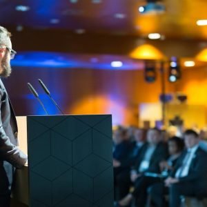 keynote-at-business-meeting-describes-process-of-leading-entertainment-expert-and-common-reasons-to-entertain-with-marketing